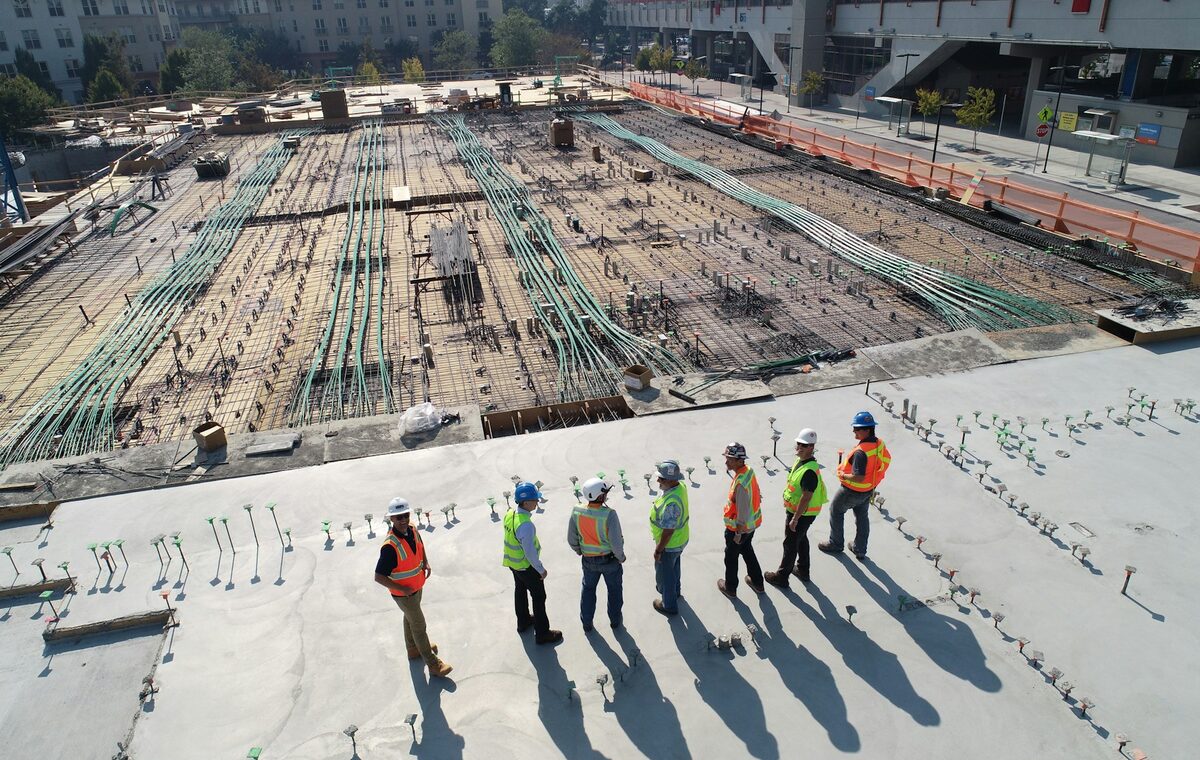 Engineers reviewing work at a large construction project